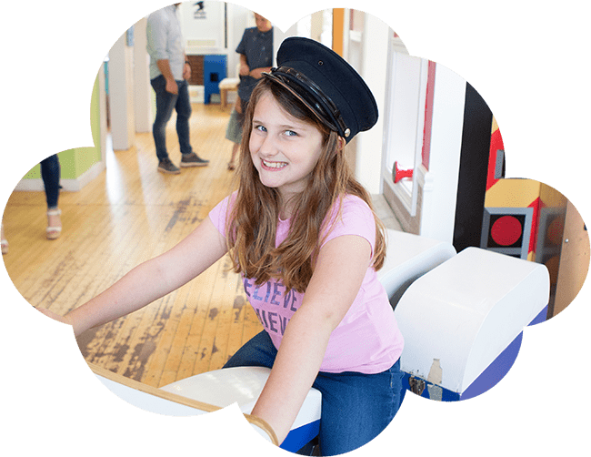 girl on a ride in a museum
