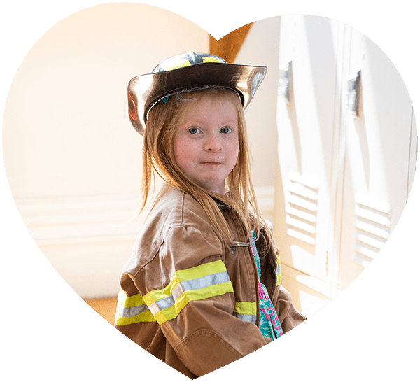 little girl dressed as a fire woman