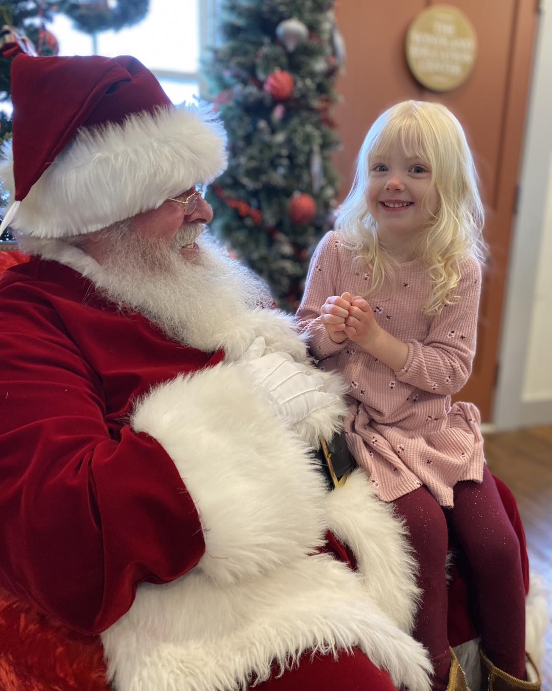 girl talking to santa