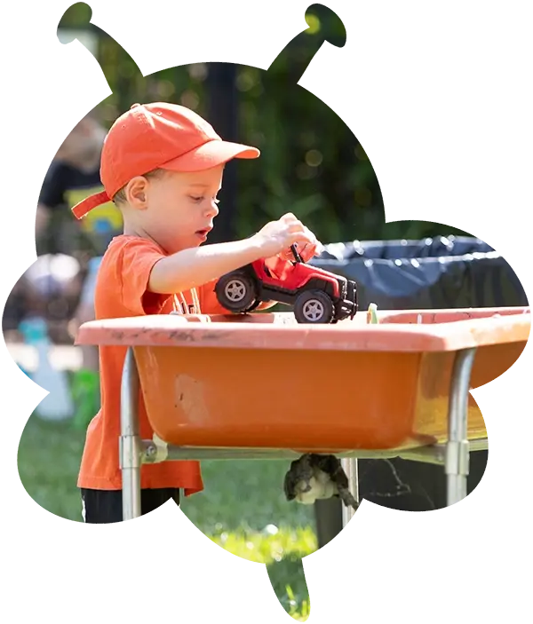 child playing with a car